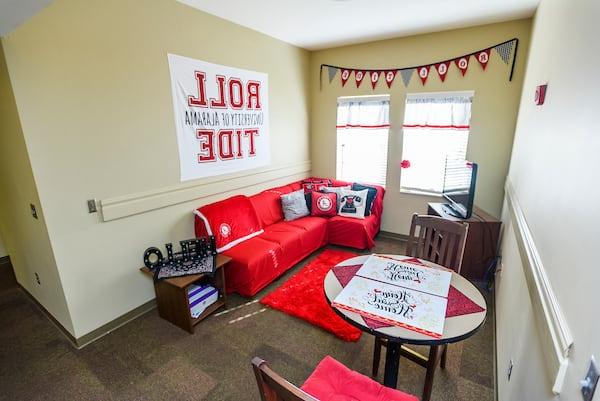 A student's living room decorated with 十大老品牌网赌大全 banners.